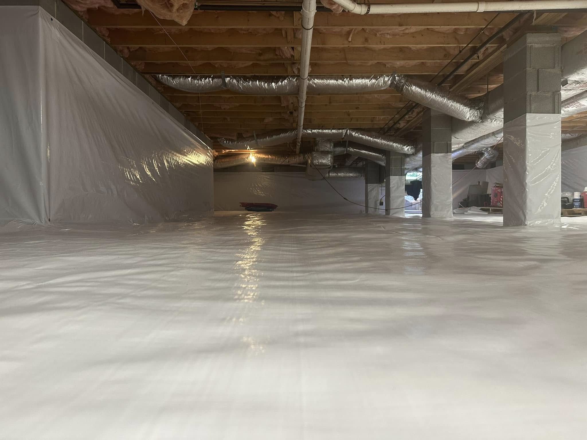 Encapsulated crawl space with a white vapor barrier
